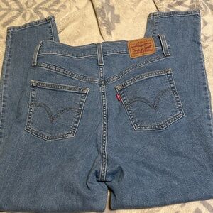 A75.  Levi's Women's High Rise Tapper  Blue Jeans